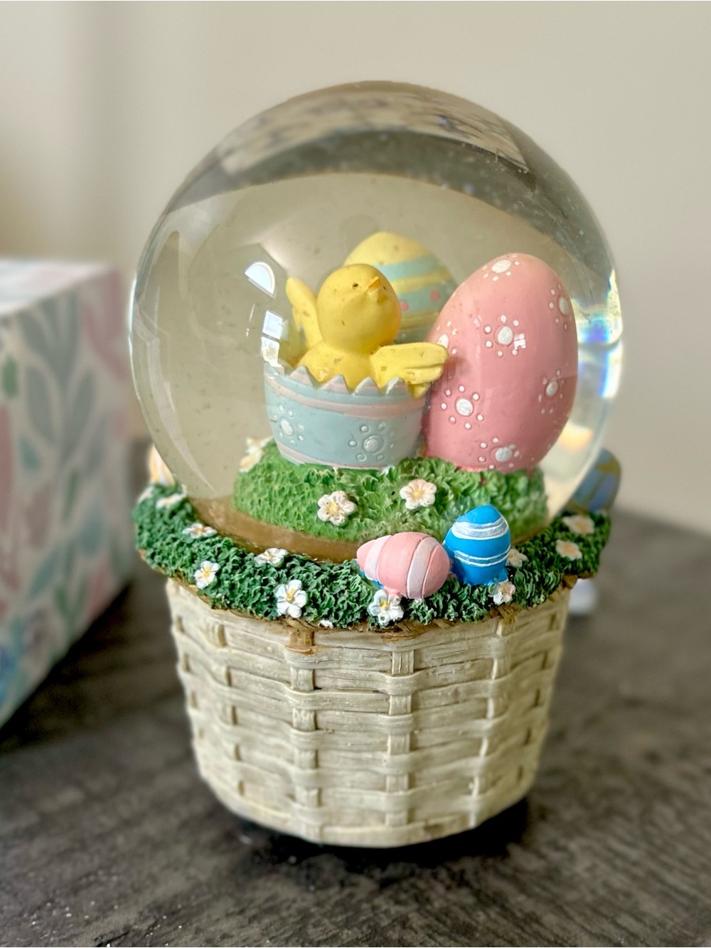 Charming Easter Yellow Chick Snowglobe with Colorful Eggs in a Basket with Grass